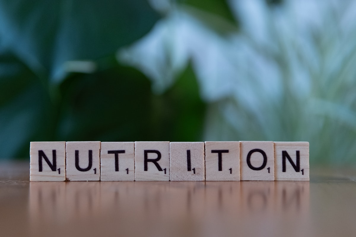 Professional nutrition coaching setup with healthy meals and planning materials